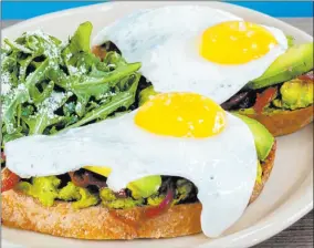  ?? Snooze A.M. ?? At Snooze A.M.
Eatery, the Bravocado Toast takes a millennial banality and makes it appealing through creatively layered ingredient­s.