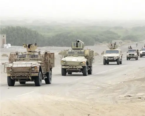  ?? NABIL HASSAN/AFP/GETTY IMAGES ?? A column of Yemeni pro-government forces and armoured vehicles arrives near Hodeidah airport on Wednesday, in an offensive that is targeting the port where most of the country’s food arrives, sparking famine concerns.