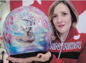  ?? CANADIAN PRESS FILE PHOTO ?? Canada's Mirela Rahneva holds her helmet honouring her late mother, Valentina, after being named to the Canadian Olympic skeleton team in Calgary in January.