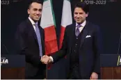  ?? — AP ?? In this photo taken on March 1, 2018, Giuseppe Conte ( right) shakes hands with leader of the Five- Star Movement, Luigi Di Maio, during a meeting in Rome.