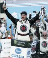  ?? RICK SCUTERI — THE ASSOCIATED PRESS ?? Monster Energy NASCAR Cup Series driver Kevin Harvick (4) celebrates after winning a NASCAR Cup Series auto race on Sunday in Avondale, Ariz.