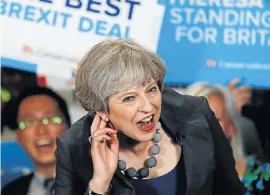  ?? Picture: GETTY IMAGES ?? EAR, EAR: British Prime Minister Theresa May in an unusually animated mood on the hustings