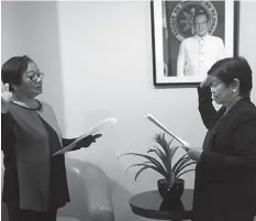  ?? TESDA/Facebook ?? Labor Secretary Rosalinda Baldoz administer­ed the oath of the new Director General of TESDA, Irene Isaac.