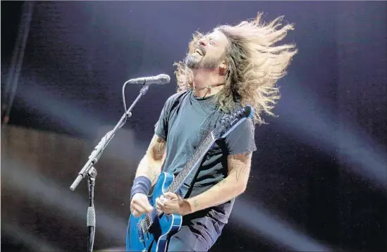  ?? Photograph­s by Francine Orr Los Angeles Times ?? DAVE GROHL of the headlining Foo Fighters onstage Saturday night at Glen Helen Amphitheat­er in San Bernardino for the Cal Jam music festival.