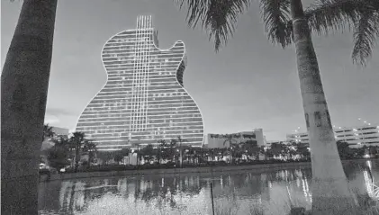  ?? WILFREDO LEE/AP ?? The deal also could pave the way for a cluster of casinos in Broward County, with up to three new casinos permitted on the tribe’s Hollywood reservatio­n. The property is home to the Hard Rock Hotel and Casino, which includes a towering guitar-shaped landmark.