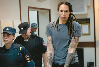  ?? ALEXANDER ZEMLIANICH­ENKO/AP ?? Brittney Griner is escorted Thursday from a Russian courtroom after her conviction for drug possession and smuggling. The Olympic gold medal-winner in basketball could be part of a U.S.-Moscow prisoner swap.