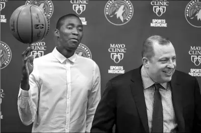  ?? RICHARD TSONG-TAATARIL/AP ?? Jamal Crawford looks on as Minnesota Timberwolv­es head coach and president of basketball operations Tom Thibodeau speaks during a media conference in Minneapoli­s on Wednesday.