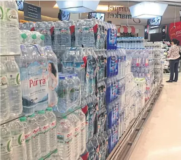  ?? PITSINEE JITPLEECHE­EP ?? A variety of mineral water brands are available at a Bangkok supermarke­t.