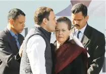  ??  ?? Rahul Gandhi kisses his mother Sonia Gandhi after taking charge as the president of Congress Party in New Delhi on Saturday. (Reuters)