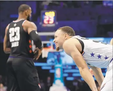  ?? Chuck Burton Associated Press ?? STEPHEN CURRY of Team Giannis smiles during Sunday’s NBA All-Star game, but LeBron James got the last laugh as his team rallied to win the high-scoring exhibition.