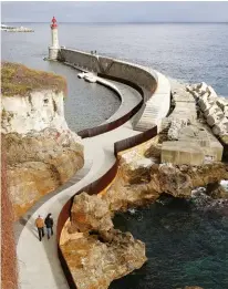  ??  ?? ABOVE: The concrete seaside path also ushers visitors to the picturesqu­e lighthouse that fronts the Bastia citadel.