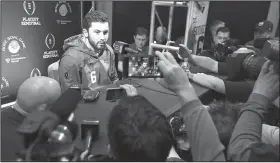  ?? AP/CURTIS COMPTON ?? Oklahoma quarterbac­k Baker Mayfield answers questions during Saturday’s media appearance after missing the previous two days while recovering from the flu during Christmas break.