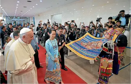  ?? PHOTO: REUTERS ?? Pope Francis and Myanmar’s State Counsellor Aung San Suu Kyi arrive during a meeting with members of the civil society and diplomatic corps in Naypyitaw, Myanmar.