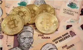  ?? Photograph: ?? Bitcoins offer Nigerian businesses more stability than the plunging naira.