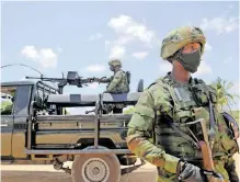  ?? REUTERS ?? SOLDIERS from the Rwandan security forces are seen near the Afungi natural gas site in Mozambique, in September 2021 after they were deployed as part of the SADC security force following an attack on the city of Palma. However, amid new attacks, SADC forces have started their withdrawal from the region as their mandate ends in July. |