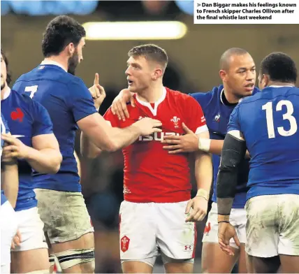  ??  ?? > Dan Biggar makes his feelings known to French skipper Charles Ollivon after the final whistle last weekend