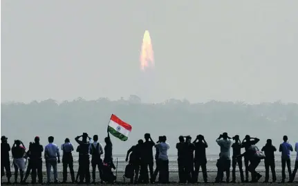  ?? Arun Sankar / AFP; Courtesy Mohammed bin Rashid Space Centre ?? The Nayif-1 was among the 104 satellites launched from Satish Dhawan Space Centre in Sriharikot­a, India, yesterday. Below, despite its small size, Nayif-1 has a clutch of scientific objectives as part of its mission.