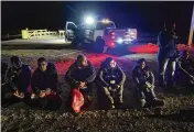  ?? AP FILE ?? Migrants wait to be processed after crossing the border near Yuma, Ariz., on Jan. 6. Most Mexican migrants will be exempt from a rule proposed on Tuesday.