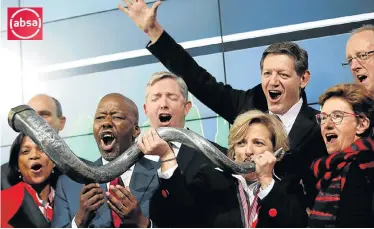  ?? Picture: SIPHIWE SIBEKO/REUTERS ?? PROUD ROOTS: Absa CEO Maria Ramos blows a horn at the bank’s rebranding at the Johannesbu­rg Stock Exchange