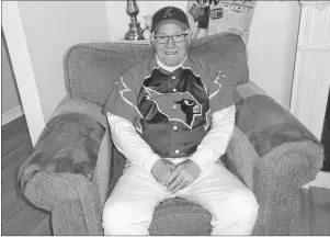  ?? SUBMITTED PHOTO ?? Kenny Timmons Jr. relaxes at home in his Chants Funeral Home Cardinals fastball team jersey. Timmons has been playing ball for 67 years.