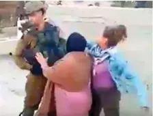  ?? Ahed Ali Tamimi ?? A still from the video shows Ahed Al Tamimi slapping an Israeli soldier in the village of Nabi Saleh