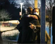  ?? (Star-Telegram via AP/Yffy Yossifor) ?? Congregati­on Beth Israel Rabbi Charlie Cytron-Walker, facing camera, hugs a man after leading a healing service Monday night at White’s Chapel United Methodist Church in Southlake, Texas. Cytron-Walker was one of four people held hostage one week ago at his Colleyvill­e, Texas, synagogue.