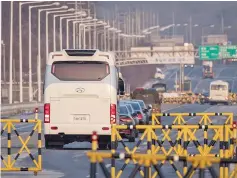  ??  ?? A convoy carrying a delegation of South Korean officials passes a checkpoint leading to the truce village of Panmunjom, near the Demilitari­zed Zone (DMZ) separating North and South Korea at Tongil bridge in Paju. — AFP photo