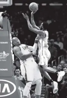  ??  ?? Nuggets guard Will Barton takes a shot over Clippers center Marreese Speights during the first half of Denver’s 119-102 loss in Los Angeles on Tuesday night. Chris Carlson, The Associated Press