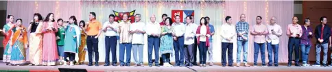  ??  ?? Bishop Hii and Vincent (front row, sixth and second right, respective­ly) join Dr Hii, Swee Nguong, Teresa and Yong (front row – seventh right, fifth, fourth and third right, respective­ly) in the candle-lighting ceremony to mark the opening of Shosa-Seosa joint grand reunion dinner.