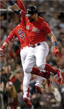  ?? Stuart caHill pHOtOs / Herald staff ?? BIG BATS: Kyle Schwarber, above right, celebrates his solo home run with Kiké Hernandez during the third inning against the Yankees in the American League Wild Card Game at Fenway Park on Tuesday night. At right, Xander Bogaerts screams out after hitting a tworun blast in the first inning.