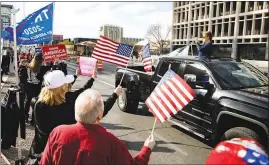  ?? YASMINA CHAVEZ ?? Supporters of President Donald Trump gather Wednesday in front of the Lloyd D. George Federal Courthouse in downtown Las Vegas during a protest and car parade.