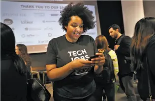  ??  ?? Top: Beth Andres-Beck, Long-Term Stock Exchange software engineer, chats with Daksh Sharma at the Tech Jobs Tour stop in S.F. Above: Angie Coleman is in charge of outreach.