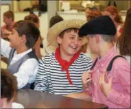  ?? MARIAN DENNIS – DIGITAL FIRST MEDIA ?? Middle school students at St. Aloysius Parish School were all smiles Wednesday as they enjoyed a buffet of foods from different cultures for lunch to celebrate Heritage Day.