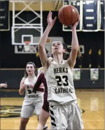  ?? BILL UHRICH — READING EAGLE ?? Berks Catholic’s Caraline Herb scores her 1,000th career point in the first quarter against Gov. Mifflin on Friday at Wolf Gymnasium.