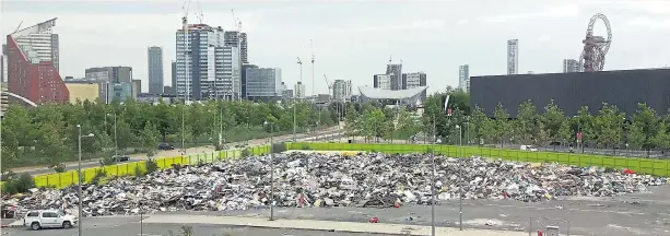  ?? Pictures: CHRIS CLARKE / SWNS ?? A massive clean-up operation will now begin after a huge pile of rubbish was illegally dumped by travellers at an empty site near the Olympic Stadium in London