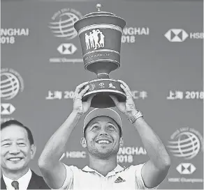  ?? JOHANNES EISELE/AFP/GETTY IMAGES ?? Xander Schauffele won the World Golf Championsh­ips-HSBC Champions in Shanghai by defeating Tony Finau in a playoff.