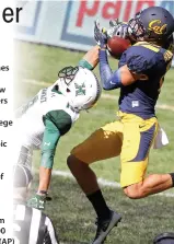  ??  ?? MY BALL: California Golden Bears Chad Hansen, right, catches a touchdown pass over Hawaii Rainbow Warriors Jalen Rogers during the opening game of the US college football season at the Sydney's Olympic stadium in Sydney Saturday. The last American...