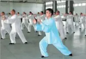  ?? PROVIDED TO CHINA DAILY ?? A teacher leads residents practicing a tai chi routine at a rehabilita­tion facility in Shanghai.