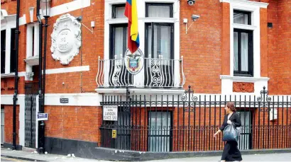  ?? Reuters file ?? A pedestrian passes the Ecuadorian Embassy where Wikileaks founder Julian Assange is living in London. —