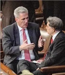  ?? Kent Nishimura Los Angeles Times ?? McCARTHY talks with Rep. Andrew S. Clyde (R-Ga.) on the f loor of the House of Representa­tives during one of the votes for speaker.