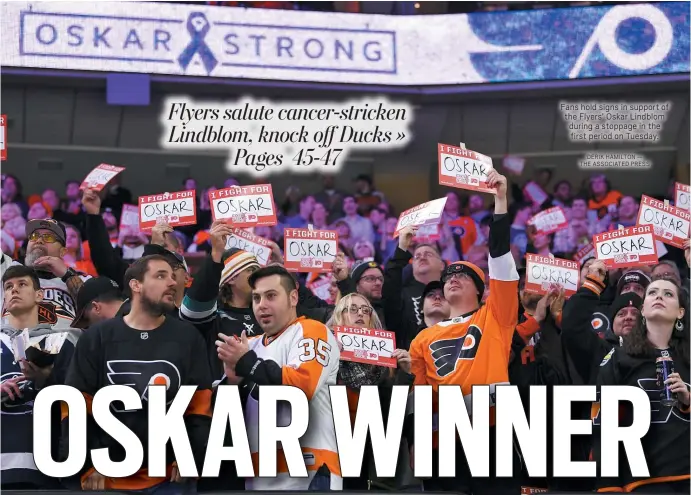  ?? DERIK HAMILTON — THE ASSOCIATED PRESS ?? Fans hold signs in support of the Flyers’ Oskar Lindblom during a stoppage in the first period on Tuesday.