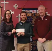  ?? Caitlan Butler / News-Times ?? Arts Center: Kiwanis President-elect Jaren Books (center) presents a check to South Arkansas Arts Center Executive Director Laura Allen (left) and Assistant Executive Director John Lowery for SAAC’s upcoming Youth Theater production of “James and the Giant Peach JR," scheduled for April 24 and 25.