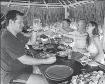  ?? DESMOND BOYLAN/ASSOCIATED PRESS PHOTOS ?? Top: Thawing relations with Cuba are allowing American tourists to enjoy such Havana hot spots as O’Reilly 304 Bar. Above: Ralph Jaeger, managing director of Siguler & Guff, from left, Pastene Companies co-owner Chris Tosi, Massachuse­tts lawyer Joseph...