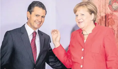  ?? FOTO: DPA ?? Bundeskanz­lerin Angela Merkel (CDU) zu Gast bei Mexikos Staatspräs­ident Enrique Pena Nieto in Mexiko-Stadt. Bei einer Wirtschaft­sveranstal­tung im Museum Interactiv­o de Economia ging es um das Thema „Deutschlan­d und Mexiko – Partner auf dem Weg in die...