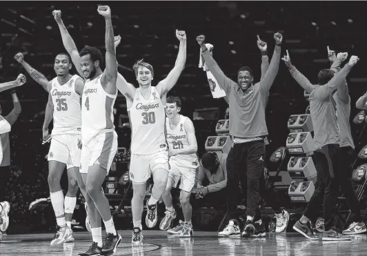  ?? Jamie Squire / Getty Images ?? The Univesity of Houston celebrates its victory over Oregon State on March 29 to clinch the Cougars’ first spot in the Final Four since 1984.