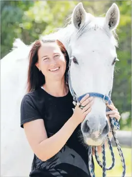  ?? Off duty:
Photo: FAIRFAX NZ ?? Blenheim police Constable Michelle Stagg divides leisure hours between caring for her horse Daisy and other animals, and high performanc­e netball umpiring.