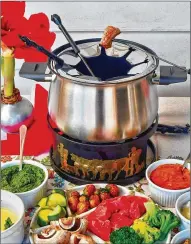  ?? ?? Beef fondue goes well with a variety of veggies and sauces.