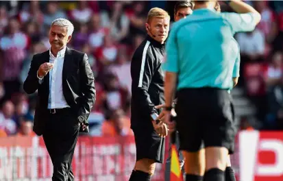  ??  ?? Off you go: Manchester United manager Jose Mourinho (left) reacts after being sent to the stands by referee Craig Pawson in the match against Southampto­n at St Mary’s yesterday. — AFP