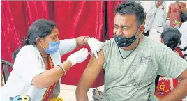  ?? ANI PHOTO ?? A man receives a dose of COVID-19 vaccine, in Prayagraj on Tuesday.