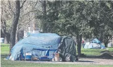  ?? STEVE RUSSELL TORONTO STAR ?? Outdoor homelessne­ss swelled in Toronto and in other cities through the COVID-19 pandemic, and the city’s operations last summer to eject people from highly visible areas pushed the issue into the spotlight.